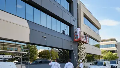 Professional commercial painters working on Aurora CO office exterior painting project
