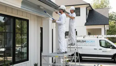 Professional painters refinishing home trim and fascia in Aurora, CO for lasting weather protection